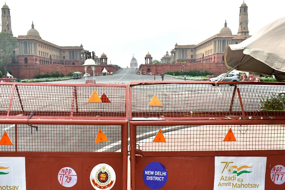 Police barricades across a road leading to the Secretariat buildings in New Delhi