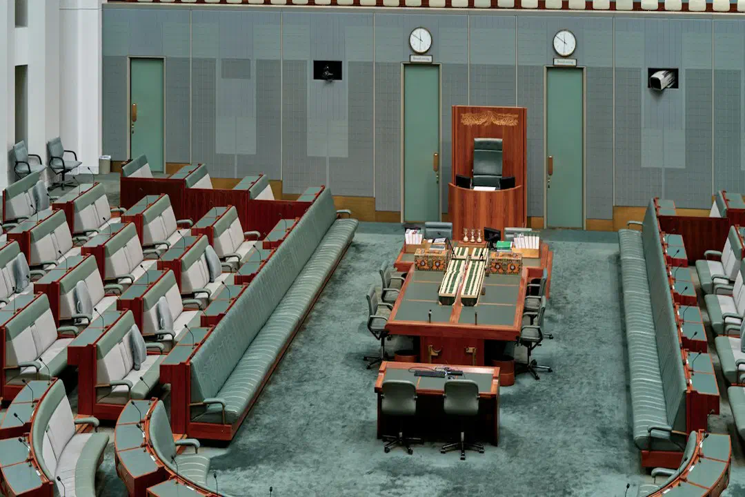 Rows of empty seats in a legislative chamber