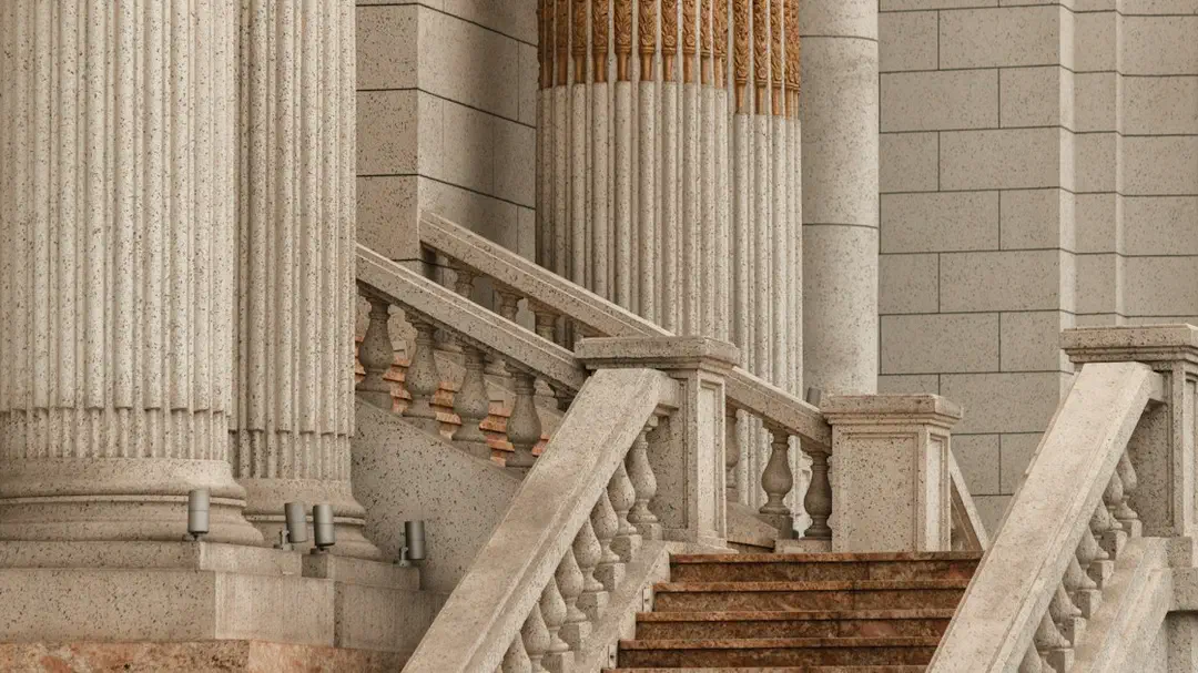 A stone staircase leading up to a building with tall classical columns